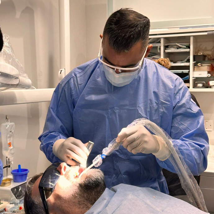 Dentist performing a dental surgery